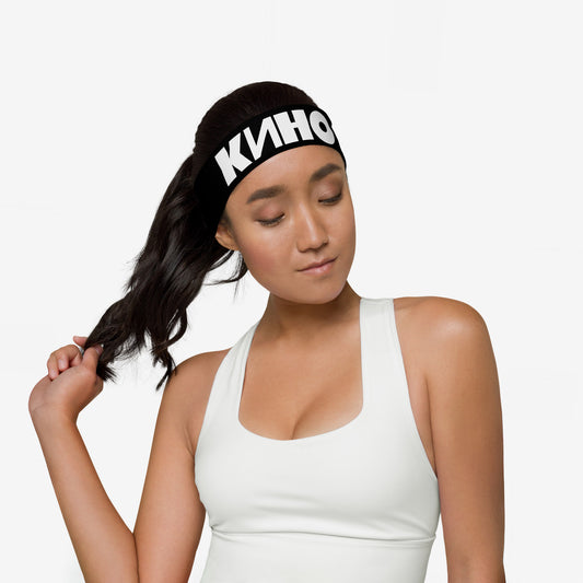 Model girl wearing official KINO band essential black headband, with Viktor Tsoi logo in Cyrillic underneath. www.kinoband.com