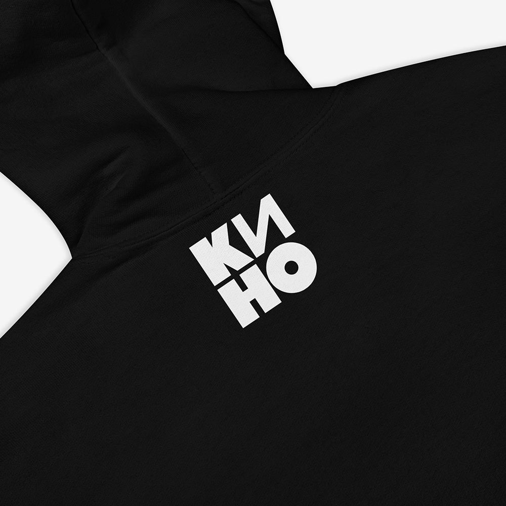 Black unisex sweatshirt with illustrated live performance of Viktor Tsoi and Gruppa Kino music band, with KINO logo beneath the image and KINO logo on the back neck side. Back side closeup photo.
