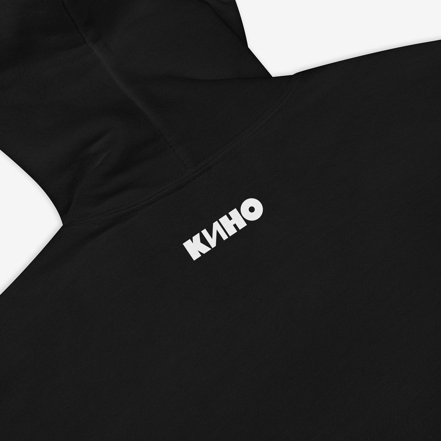 Official KINO band hoodie with elements of the Gruppa Krovi (sun) album cover behind the band members and Viktor Tsoi in the middle. Back side closeup photo with small KINO logo on the neck side. www.kinoband.com