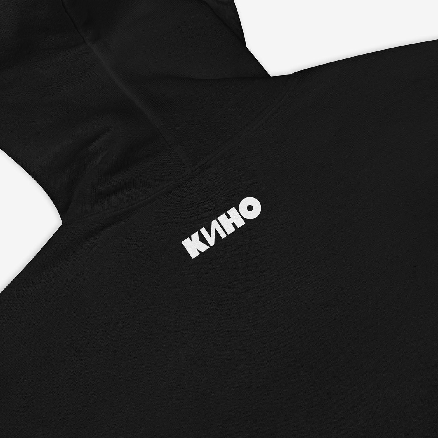 Official KINO band hoodie with elements of the Gruppa Krovi (sun) album cover behind the band members and Viktor Tsoi in the middle. Back side closeup photo with small KINO logo on the neck side. www.kinoband.com