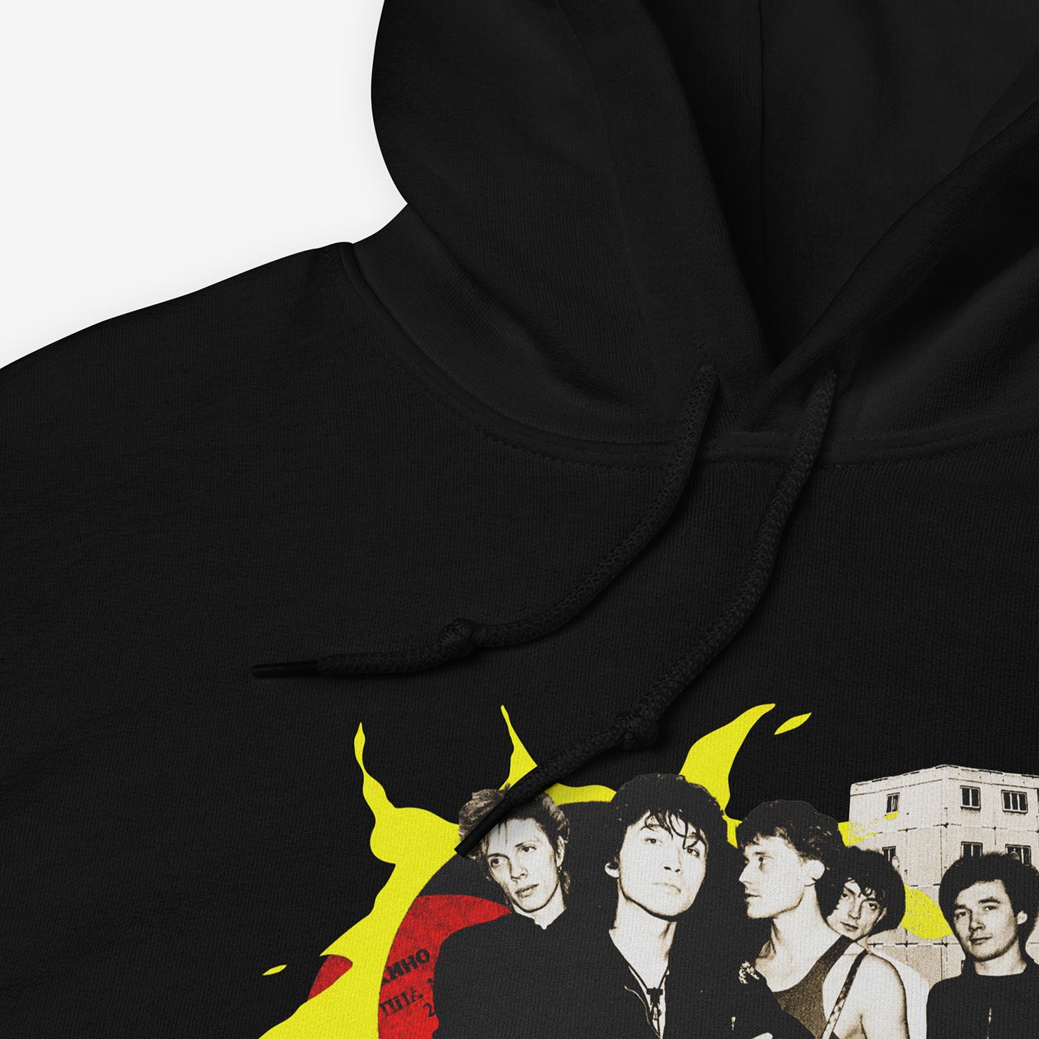 Official KINO band hoodie with elements of the Gruppa Krovi (sun) album cover behind the band members and Viktor Tsoi in the middle. Closeup photo. www.kinoband.com