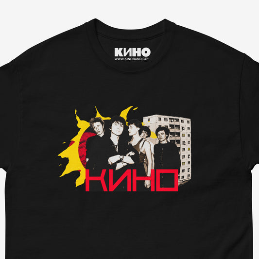 Official KINO band black T-shirt with elements of the Gruppa Krovi (sun) album cover behind the band members with Viktor Tsoi in the middle. Closeup photo. www.kinoband.com