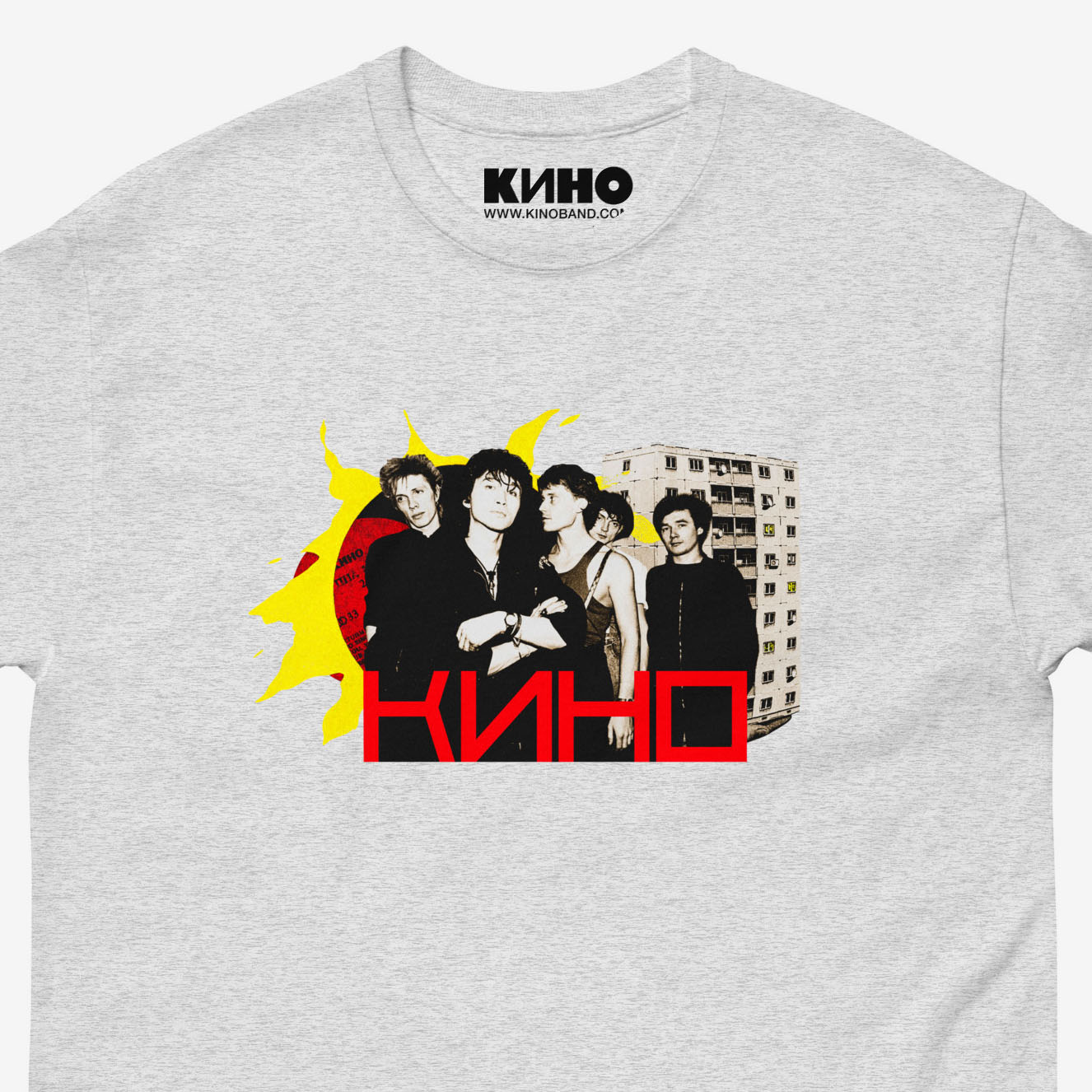 Official KINO band grey T-shirt with elements of the Gruppa Krovi (sun) album cover behind the band members with Viktor Tsoi in the middle. Closeup photo. www.kinoband.com