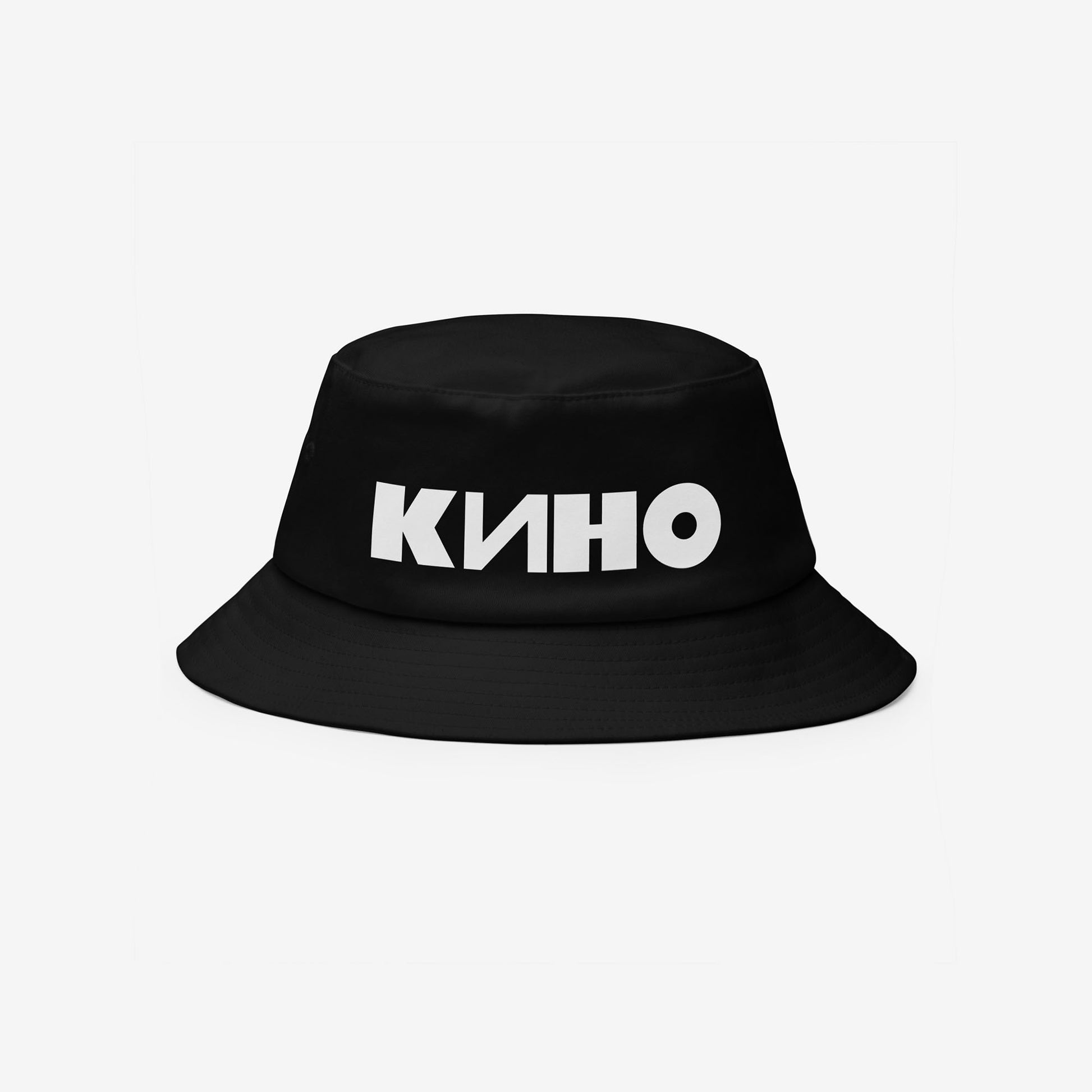 Official KINO band and Viktor Tsoi black unisex bucket hat. Minimalist design with white КИНО logo. Front side. www.kinoband.com
