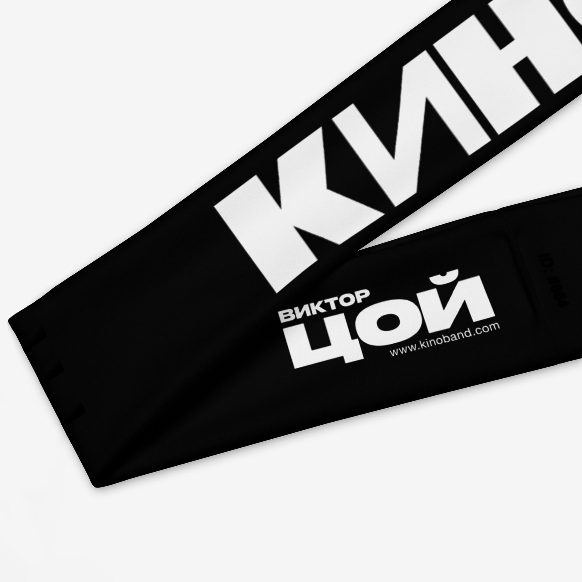 Official KINO band essential black headband, with Viktor Tsoi logo in Cyrillic underneath. Closeup detail photo. www.kinoband.com