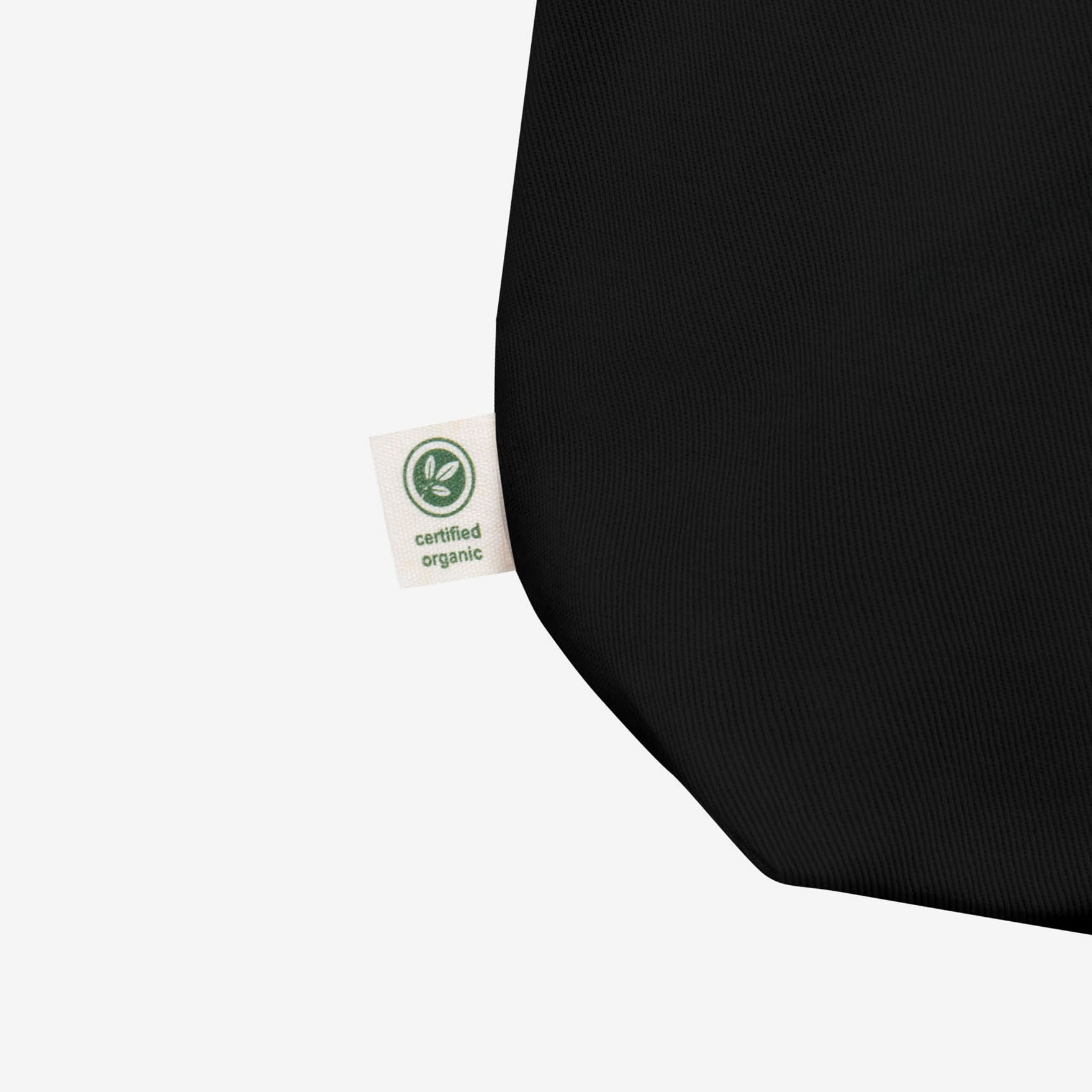 Official KINO band black tote bag featuring Star Called Sun album art on one the front  and КИНО logo on the the back. Closup detail photo with Certified Organic tag. www.kinoband.com