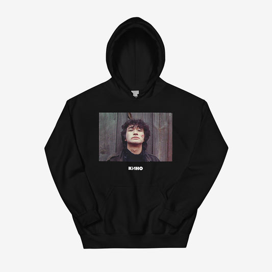 Unisex black hoodie featuring archival photo of Viktor Tsoi with blood on his face from IGLA film, little KINO logo underneath and large KINO band logo on the back, Soviet rock tribute design, Kino cult USSR merch