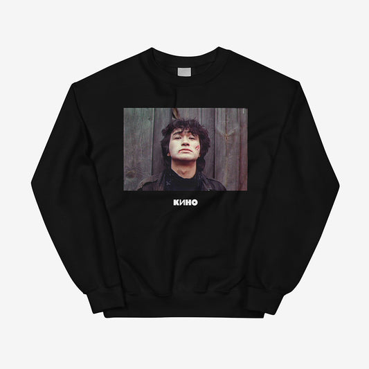 Unisex black sweatshirt featuring archival photo of Viktor Tsoi with blood on his face from IGLA film, little KINO logo underneath and large KINO band logo on the back, Soviet rock tribute design, Kino cult USSR merch