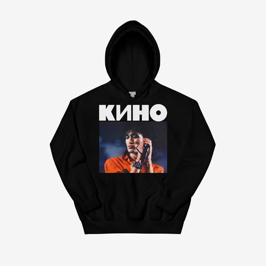 Black unisex hoodie with large Viktor Tsoi concert photo and KINO band logo above and 'Виктор Цой' logo in Cyrillic on the back. From www.kinoband.com