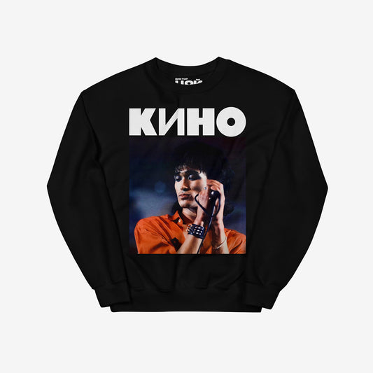 Black sweatshirt with large Viktor Tsoi concert photo and KINO band logo above. From kinoband.com
