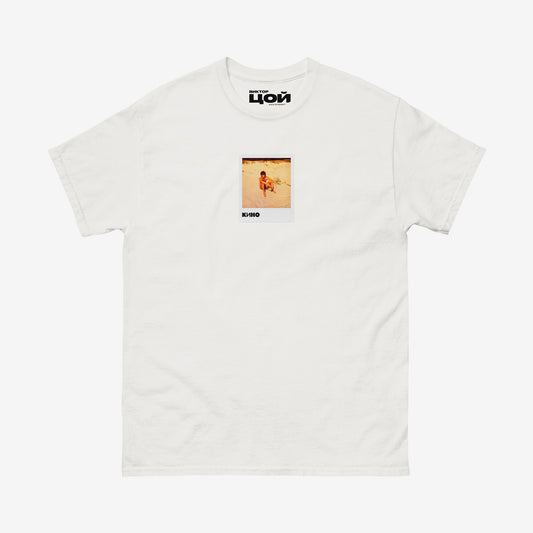 White T-shirt with rare photo of Viktor Tsoi relaxing at the beach. Original KINO band merch from www.kinoband.com