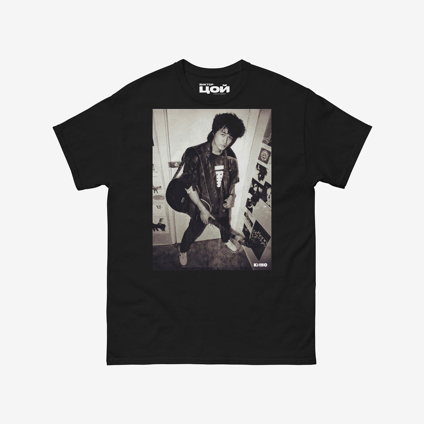 Official KINO band tshirt (black unisex Tee) with large rare photo of Viktor Tsoi in wearing a bomber jacket with guitar in an apartment. From kinoband.com
