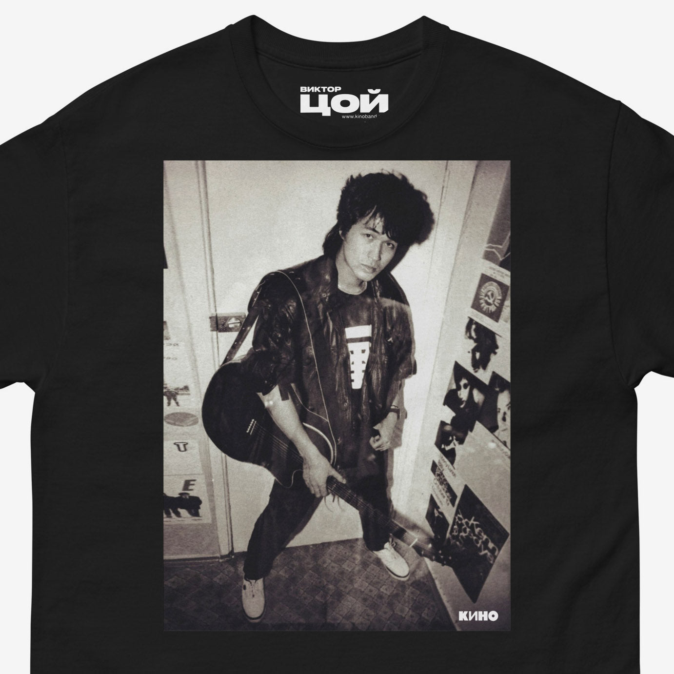 Official KINO band tshirt (black unisex Tee) with large rare photo of Viktor Tsoi in wearing a bomber jacket with guitar in an apartment. Closeup photo. From kinoband.com