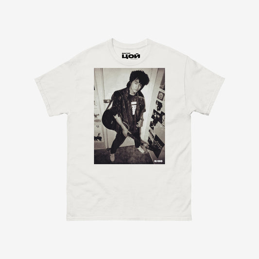Official KINO band tshirt with large rare photo of Viktor Tsoi in wearing a bomber jacket with guitar in an apartment. From kinoband.com