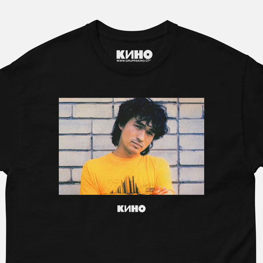 Closeup photo of a black unisex heavyweight quality cotton  KINO band t-shirt with a rare archival photo of Viktor Tsoi. From www.kinoband.com