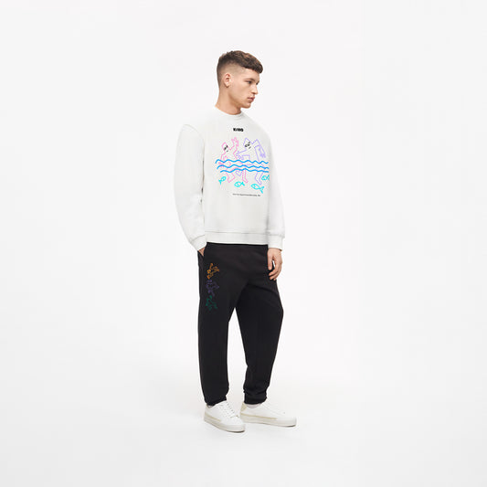 Handsome young white-skinned man wearing official white unisex KINO band sweatshirt featuring original painting by Viktor Tsoi and small КИНО logo. www.kinoband.com